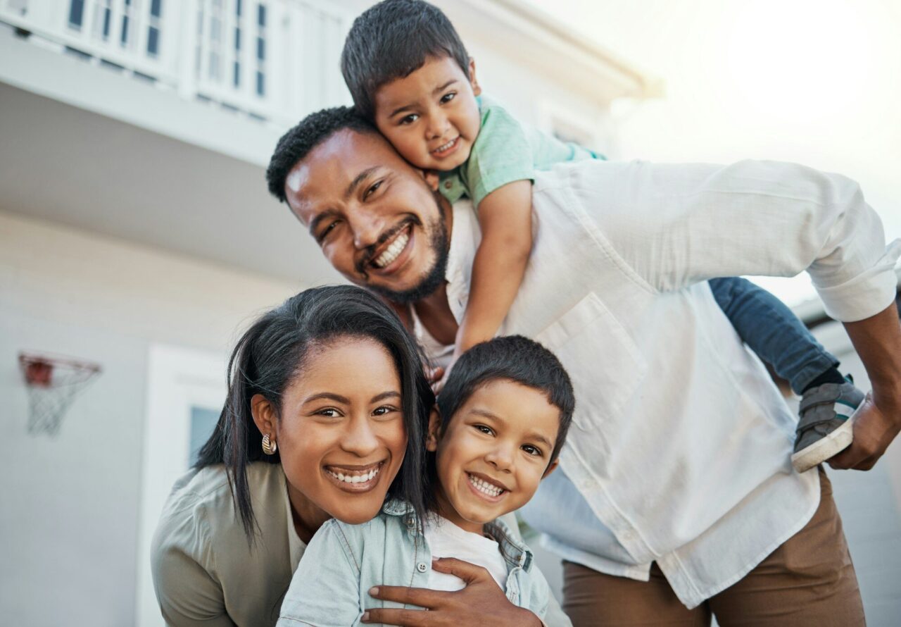 Portrait, happy family and piggyback outdoor at new home, real estate loan and building mortgage to