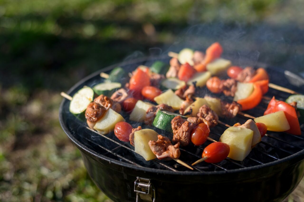 Pieces meat and vegetables bbq on grill