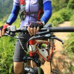 Cross country cyclist with mountain bike in the forest