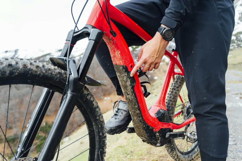 Man connecting an electric mountain bike
