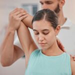 physical therapy, woman patient and physiotherapy at a spa or clinic for chiropractic consultation.