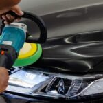 Car detailing.Man hand holding and polish the car.Polishing car wax.