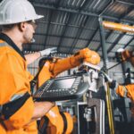 Engineer team service robot welding working in automation factory manufacturing industry technology.