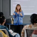 Female Office Employee Making Report at Business Conference