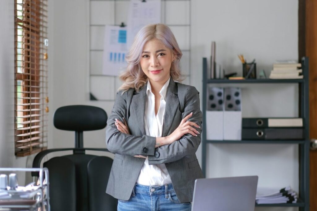 Young confident smiling Asian business woman leader, successful entrepreneur, elegant professional