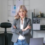 Young confident smiling Asian business woman leader, successful entrepreneur, elegant professional