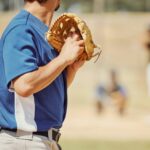 Baseball, sports and pitcher with a ball and glove to throw or pitch at a match or training. Fitnes