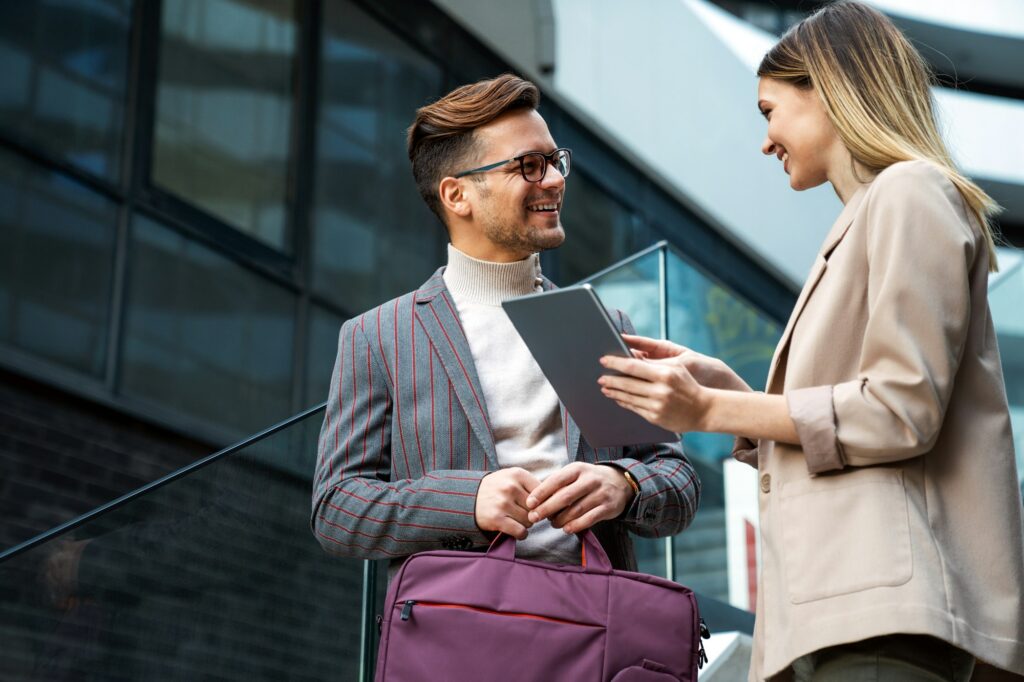 Successful business colleagues people working together on digital devices