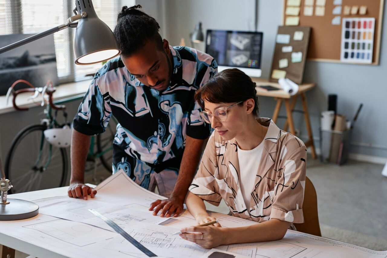 Creative young people working on interior design