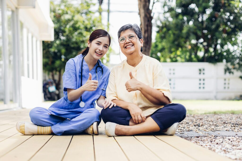 Caregiver nurse take care a Senior patient outside home. Nurse helping senior people