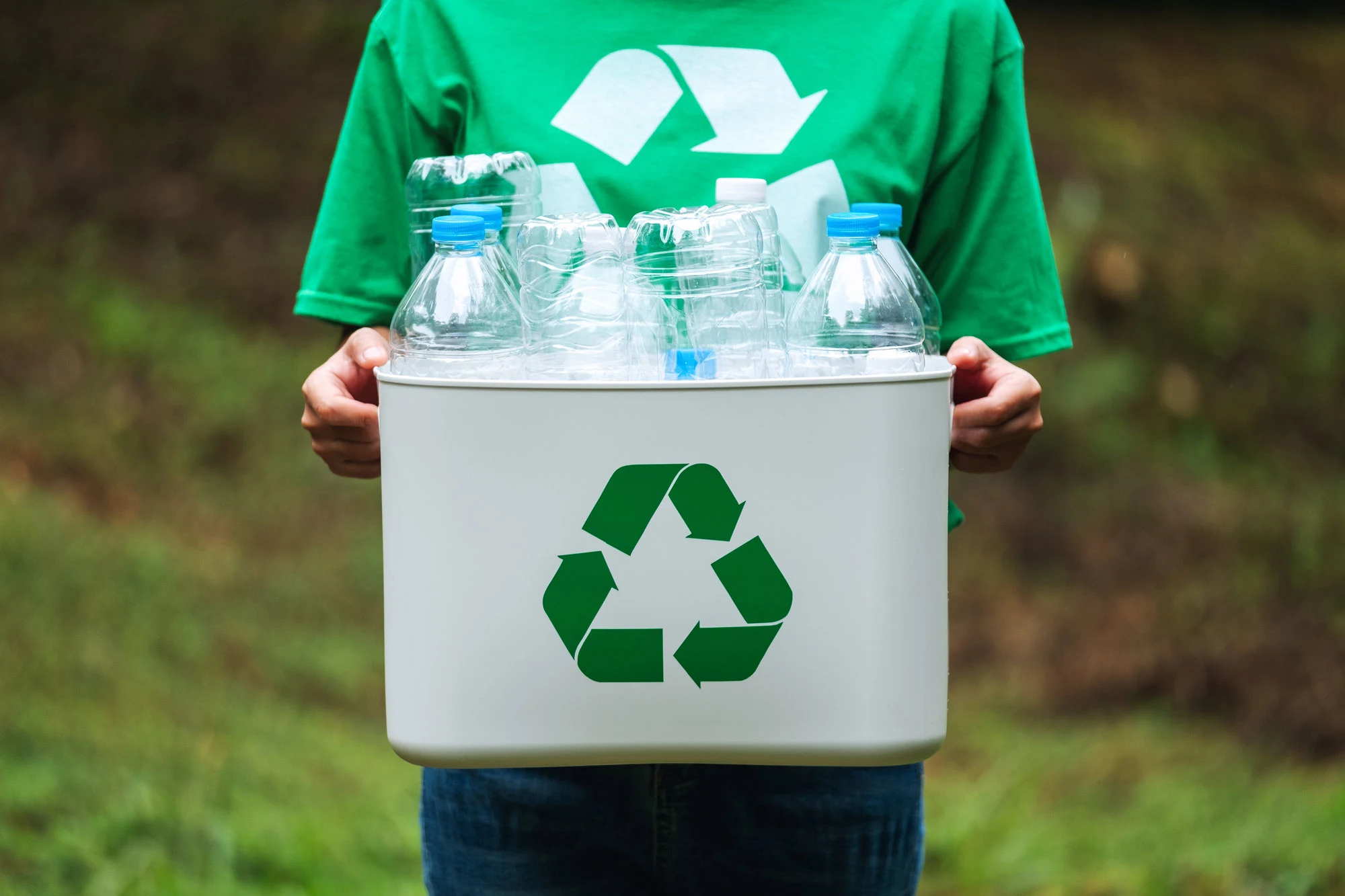 a-woman-holding-a-recycle-bin-with-plastic-bottles-2024-11-27-03-19-50-utc2.webp